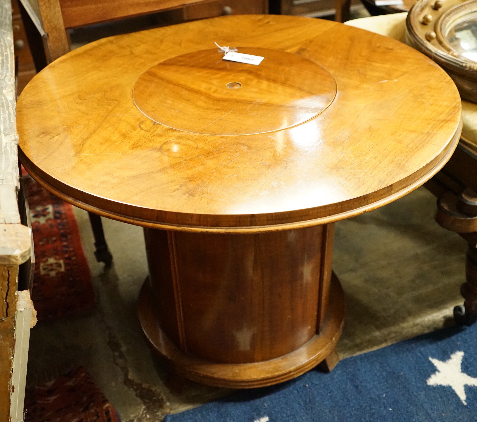 An Art Deco style circular walnut Patent Pop-up drinks table, diameter 80cm, length 92cm extended